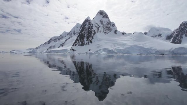 Boat track past mountain in Lemaire Channel, Antarctic Peninsula, Antarctica 