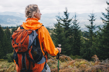 Fototapeta premium Young girl are wandering in the woods and the mountains 