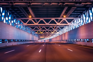 Highway speed. Tunnel. Road without cars. Highway in the tunnel.
