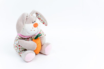 Soft toy hare on a white background