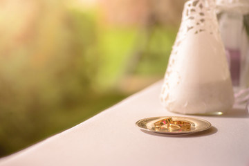 Wedding gold wedding rings on a small plate
