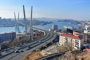 Cable-stayed bridge over Zolotoy Rog Bay and Churkina Cape in Vladivostok in winter on a Sunny day, Russia