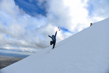 Naklejka na ściany i meble Crazy climber and success in snowy mountains