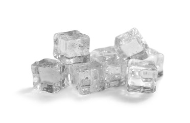 Pile of crystal clear ice cubes on white background