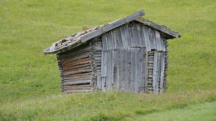 Hunting hut in nature with cloudy sky