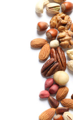 Mixed organic nuts on white background, top view