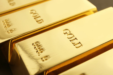 Shiny sleek gold bars as background, closeup