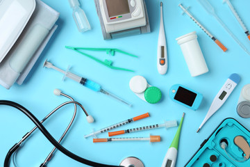 Flat lay composition with different medical objects on color background