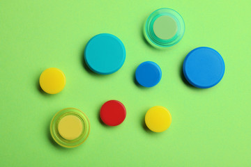Bright magnets on color background, top view