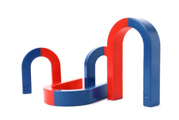 Red and blue horseshoe magnets isolated on white