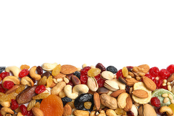Different dried fruits and nuts on white background, top view. Space for text
