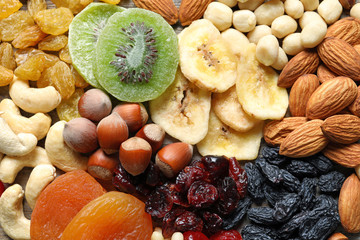 Different dried fruits and nuts as background, closeup