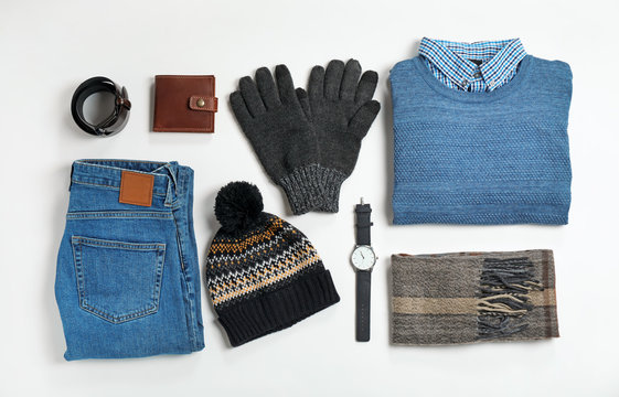 Flat lay composition with male winter clothes on white background
