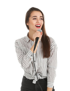 Young woman wearing casual clothes singing in microphone on white background