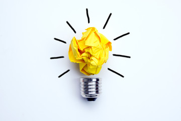 Great idea concept with crumpled yellow paper light bulb isolated on white background