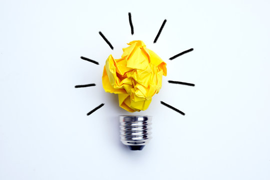 Great idea concept with crumpled yellow paper light bulb isolated on white background
