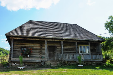 Fototapeta na wymiar Bistrita,Romania, an old wooden house in the courtyard of the Museum County,