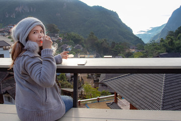  Women and coffee in the morning in the winter