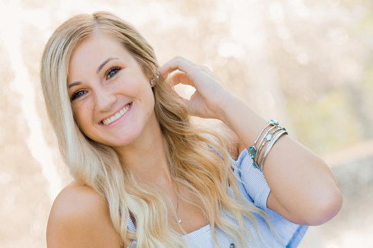 High School Senior Photo of Blonde Caucasian Girl Outdoors