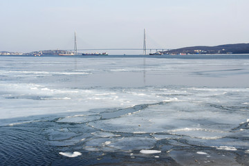 Russia. Vladivostok. Amur Bay and bridge to Russkiy island in winter