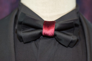 black bow tie with cherry-colored