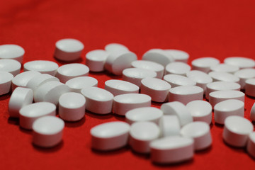 medicine pill tablet with red background