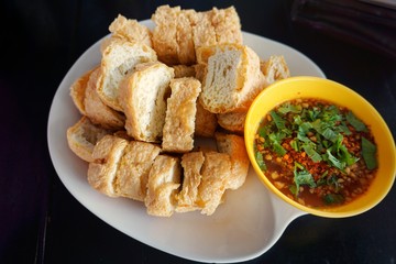 Fried tofu and dipping sauce.