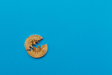 Naklejka premium Coin bitcoin is broken in half. The fall and collapse of the course of the crypto currency, the ban on trade