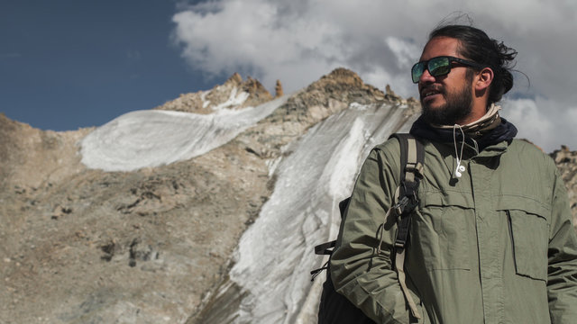 Portrait of Mixed race man traveler in mountains