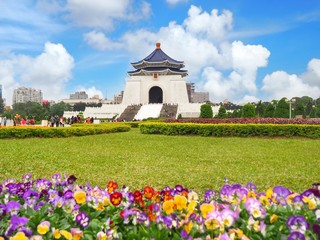 Chiang Kai-shek Memorial Hall with scenery of colorful flowers garden and green yard in Taipei, Taiwan.