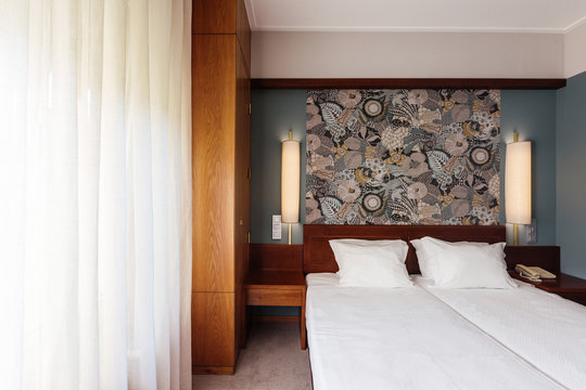Small Hotel room interior with blue colours wall, wooden elements in design