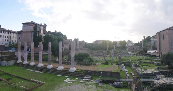 Impressive fisheye view of the Roman ruins on sunny day in Rome, Italy. Ruins of ancient civilization in the city center.