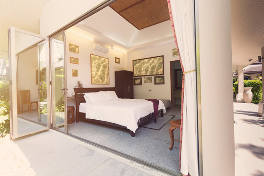 Luxury villa bed room interior. Open space, garden terrace