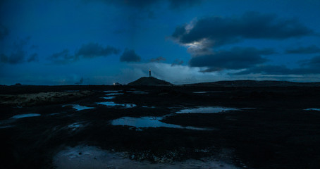 lighthouse on the hill in the blue hour