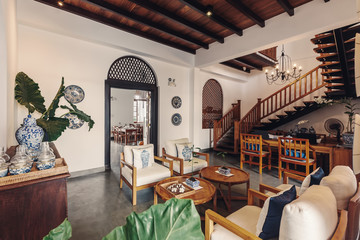 Contemporary hotel hall interior design with wooden stairs and elements