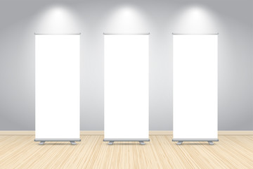 Three blank roll up banner posters display in dark blue wall, Mock up