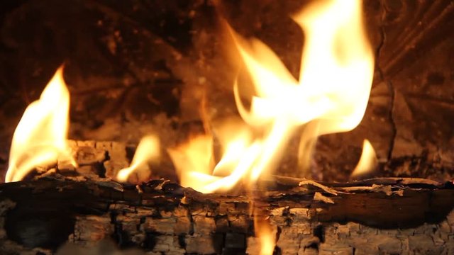 Close up of wood burning in the fireplace.