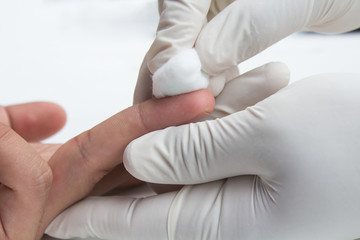 Doctor hand checking blood sugar pressure of patient in hospital  