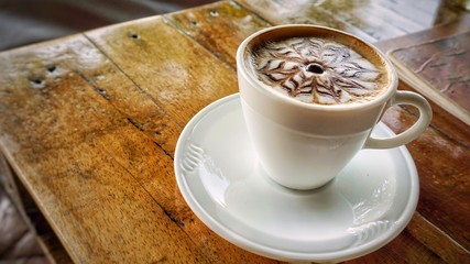 A cup of coffee with milk foam.