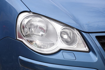 shiny headlight on a  white car