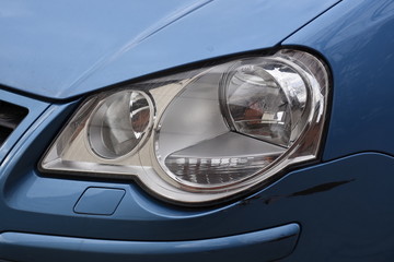 shiny headlight on a  white car