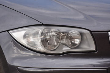 shiny headlight on a  white car