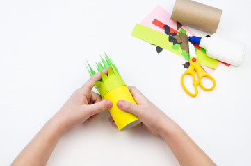 Child does the handicraft. Fruit paper. Pineapple and Watermelon summer.