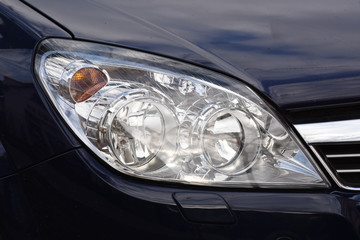 shiny headlight on a  white car