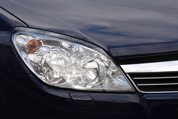 shiny headlight on a  white car