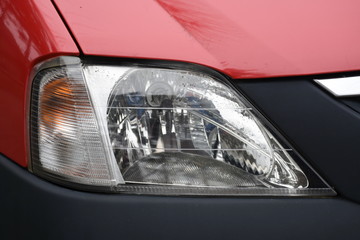 shiny headlight on a white car