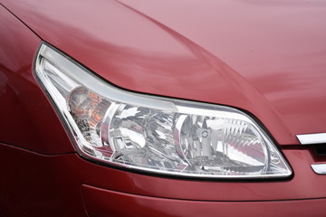 shiny headlight on a  white car