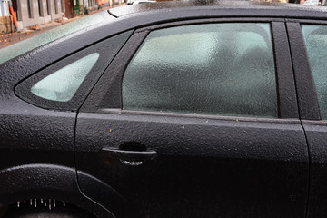 frozen car door lock,,Freezing rain ice coated car. 