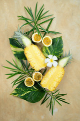 Pineapple Cut Half Maracuja Still Life Top View. Fresh Vegan Breakfast on Green Leaf Decorated with White Flower. Passion Fruit Healthy Diet for Vacation Nutrition Closeup Copy Space