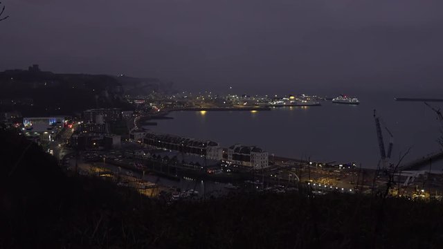 UK December 2018 - Time lapse of a P&O car and passenger ferry turning inside a misty Dover port at dusk.